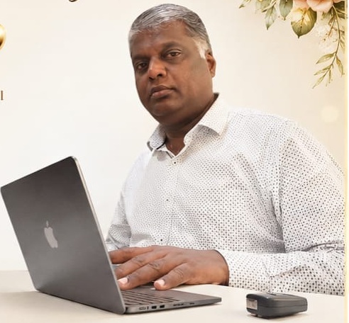 Anand Angamuthu at his desk